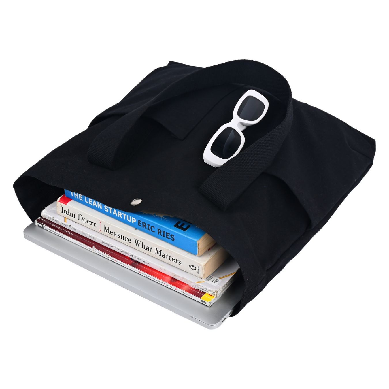 Black tote bag with books and sunglasses on a white background PT-TRO-BLK