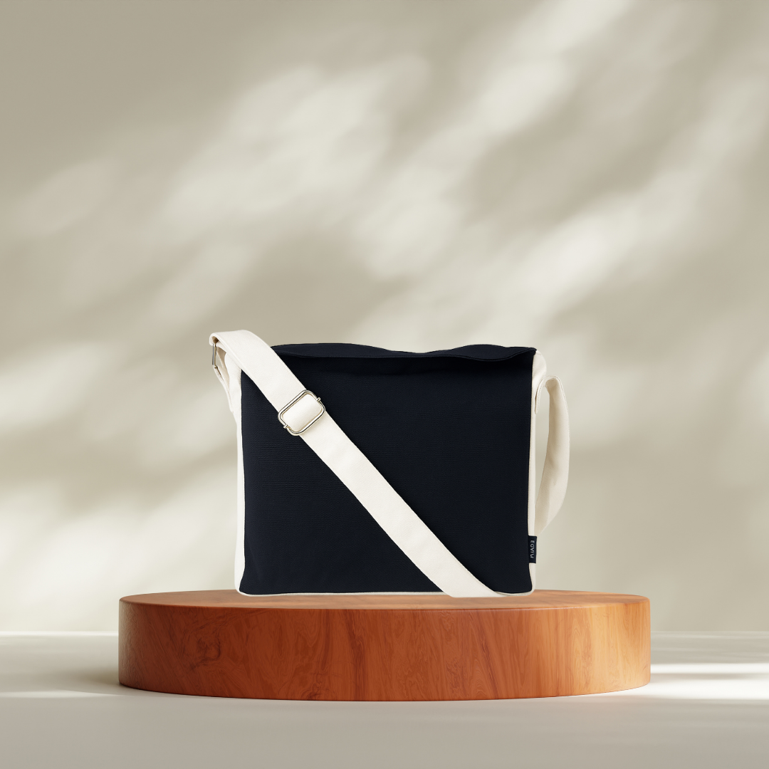 Black bag with a white strap on a wooden platform against a neutral background NC-DMC-BLK
