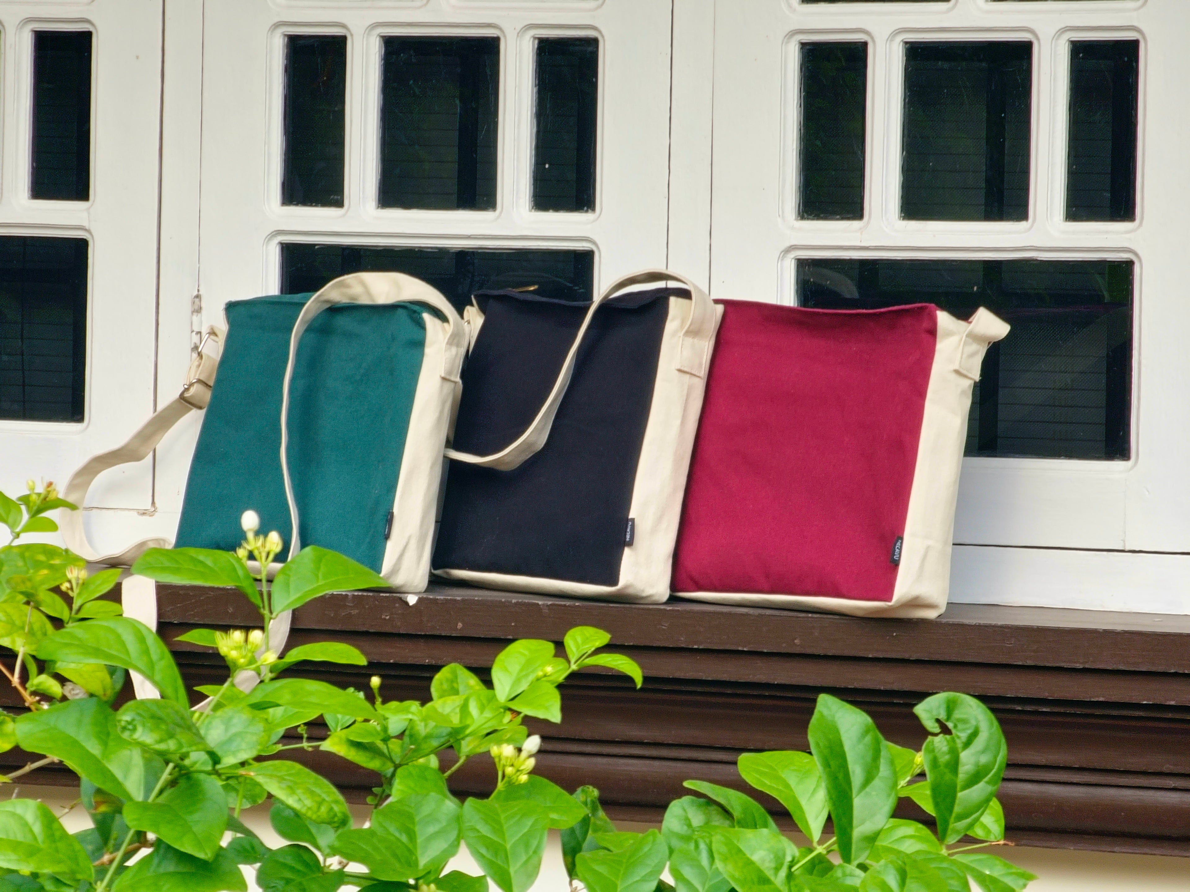 Three bags hanging on a line with greenery above NC-DMC-MRN NC-DMC-GRN NC-DMC-BLK