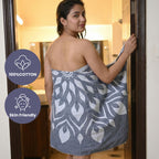 Woman wrapped in a patterned towel with product features highlighted VU-MND-MNT