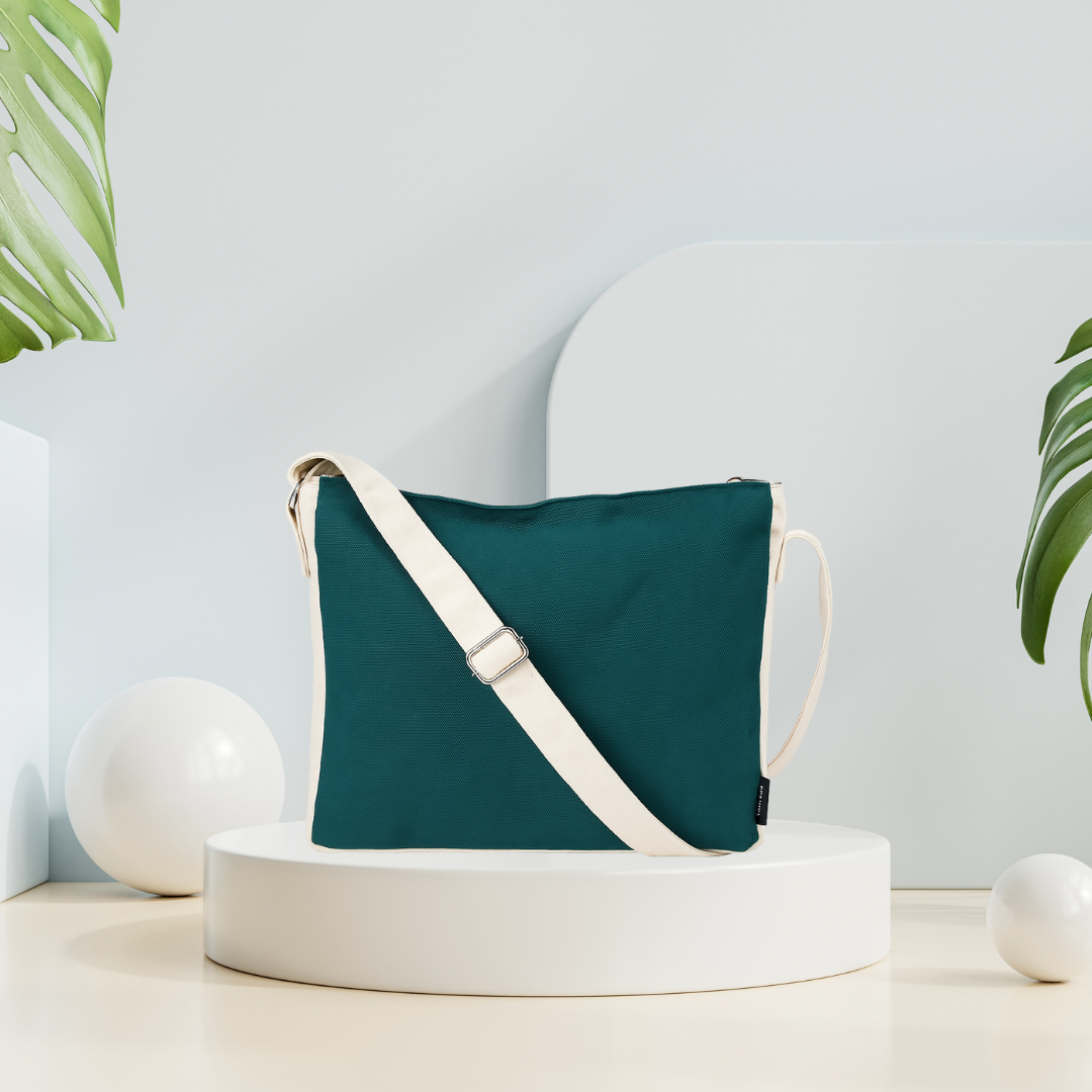  Green crossbody bag with a white strap on a white platform with a light gray background NC-DMC-GRN