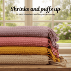 Stack of colorful textured towels on a wooden surface (SKU:[PT-WFL-YLW PT-WFL-LAC PT-WFL-BRK  PT-WFL-BIS ]