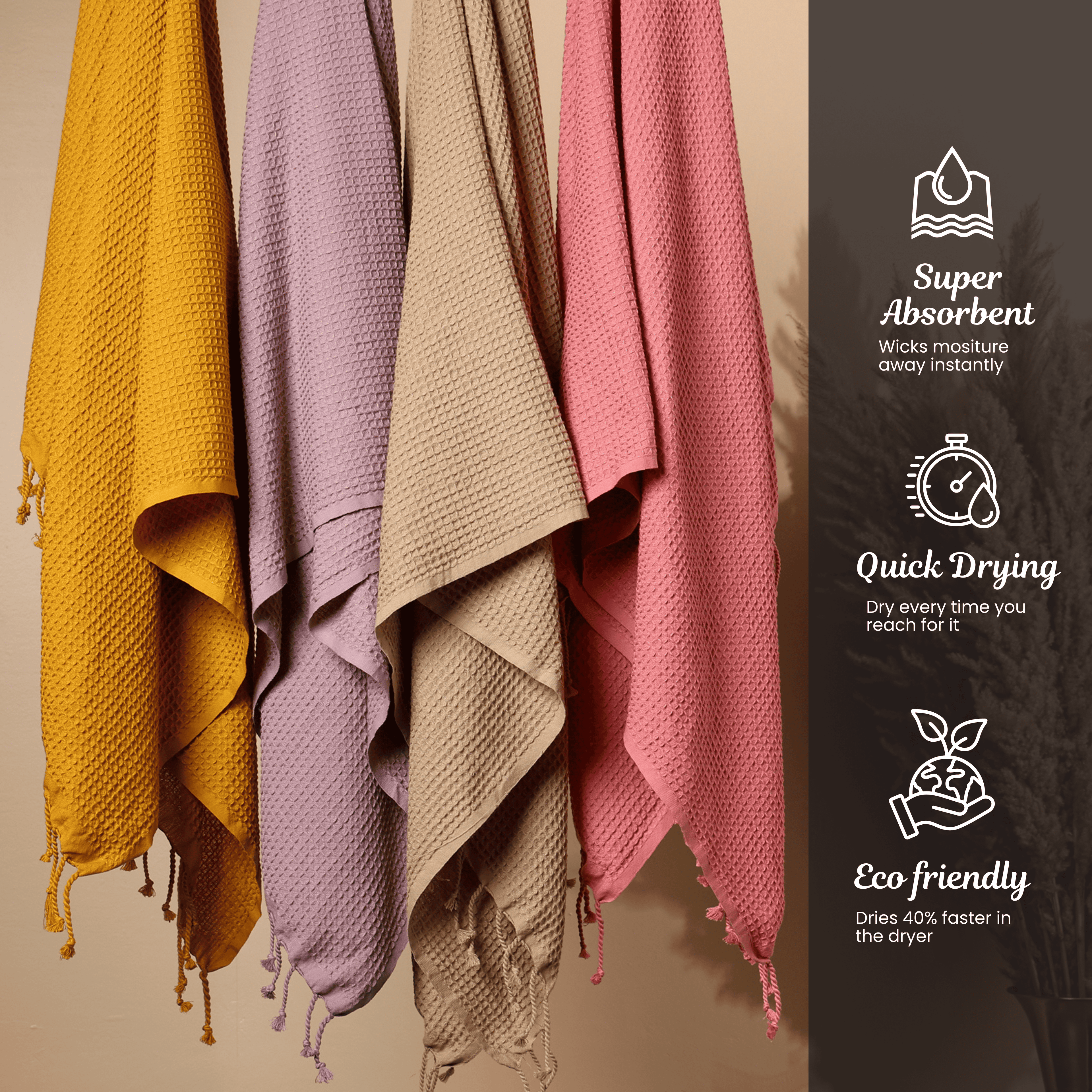 Four colorful towels hanging on a rack with text highlighting their features as super absorbent, quick drying & Ecofriendly.(SKU:[PT-WFL-YLW PT-WFL-LAC PT-WFL-BRK  PT-WFL-BIS]