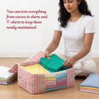 Woman folding clothes on a red Striped saree organizer on a wooden floor. (NC-SRO-RED)