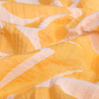 Close-up of yellow and white fabric with leaf pattern VU-MND-SUN