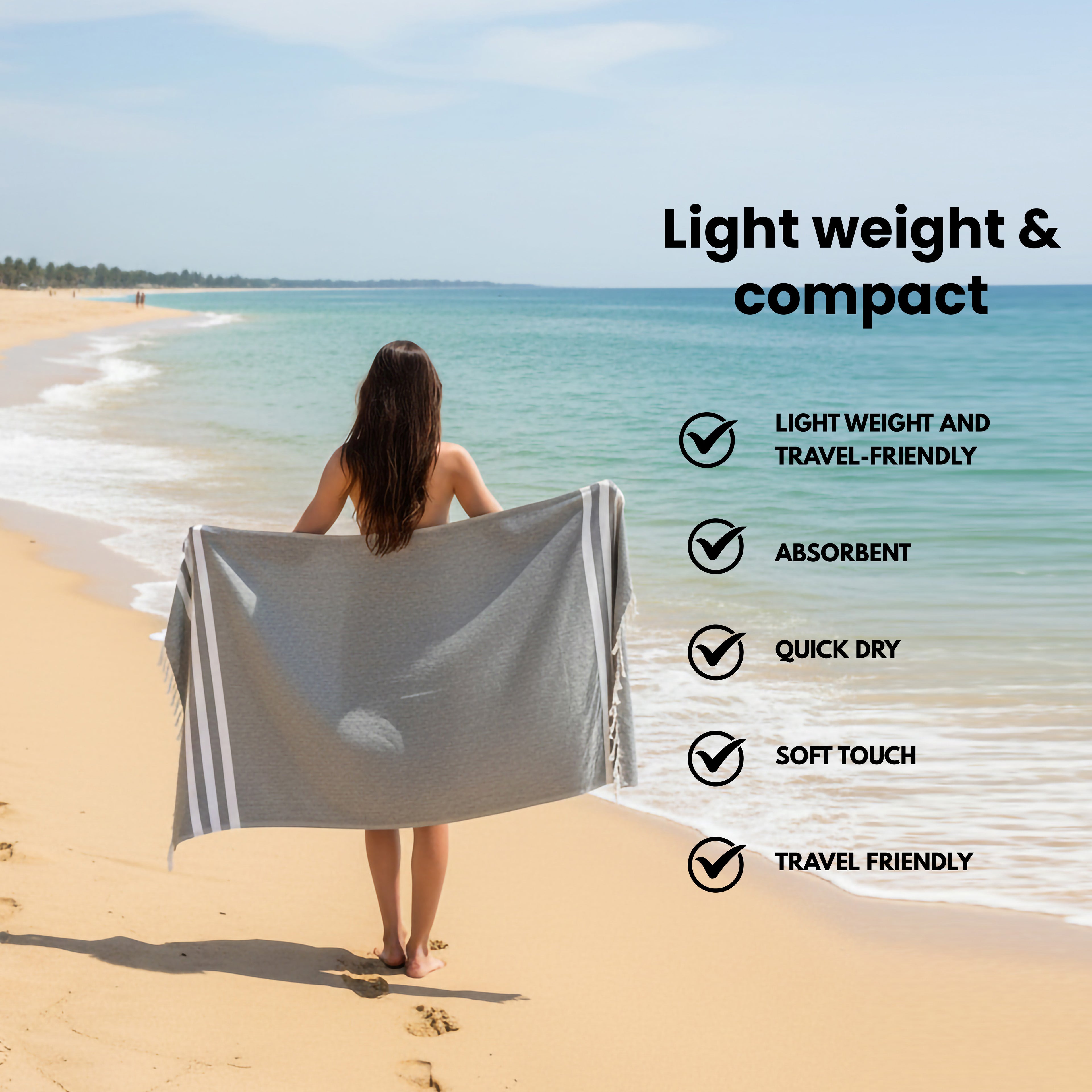 Person on a beach with a emarald bamboo towel, featuring text about towel properties.(PT-BMB-EMR)