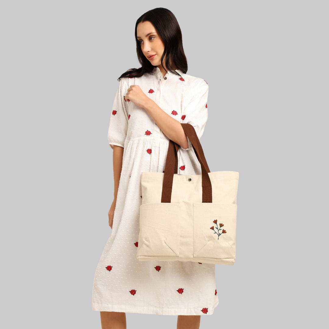 Woman holding a beige cotton tote bag with brown handles (PT-TRO-BRW)
